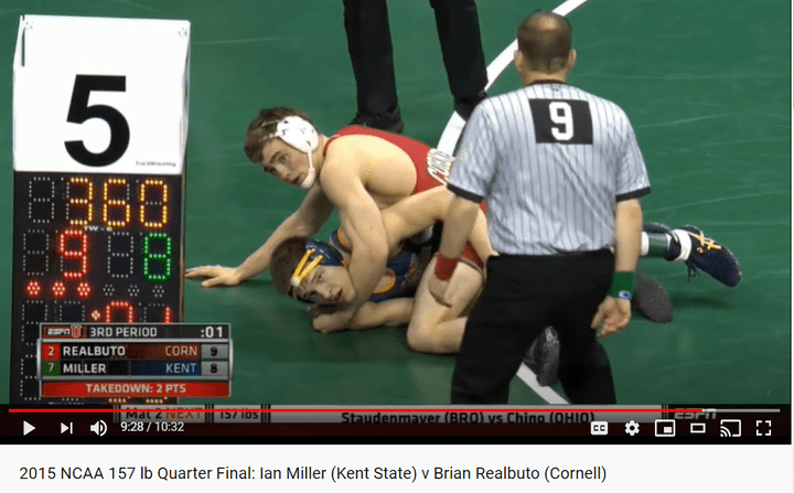 Wrestlers Checking the Clock Miller vs Realbuto at NCAAs